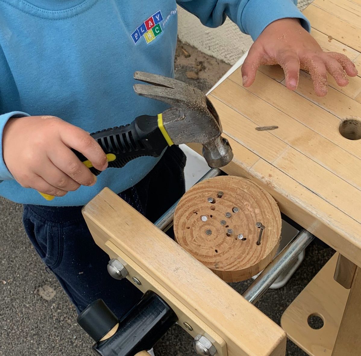 Child doing woodwork