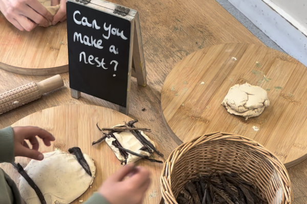 “Play dough fun…” Child engaged in sensory play at preschool in Carshalton