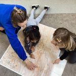 Exploring maps at Play B C Preschool