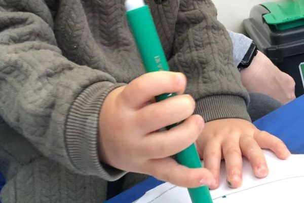 Early pencil grip, child at Play B C Preschool.